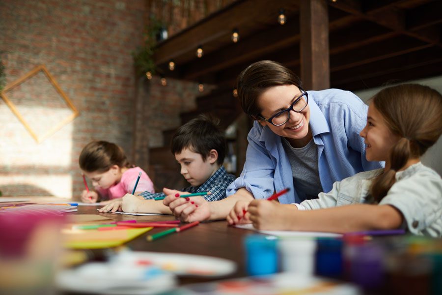 Child Care Center Insurance - Children with Teacher at the Child Care Center