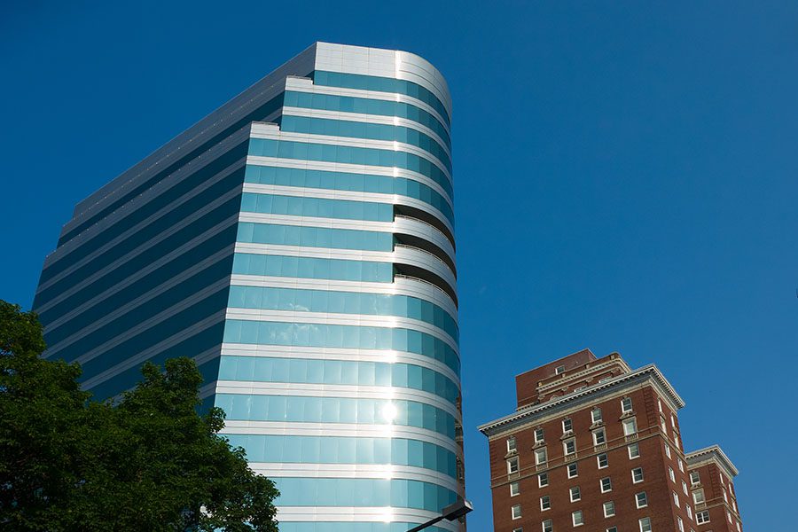 Contact - View of Two Tall Commercial Buildings Against Blue Sky in Knoxville Tennessee